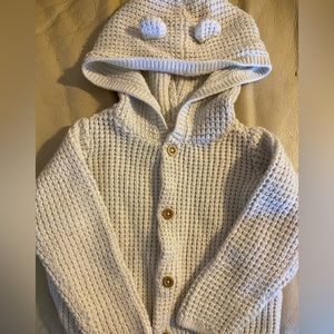 Outerwear with bear ear accents